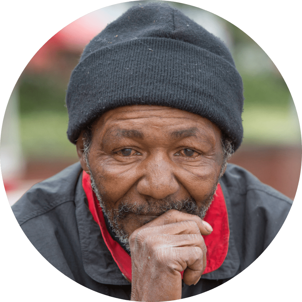 SMH_4Twelve_Man photograph of black man wearing a toque. His right hand is partially covering his mouth.